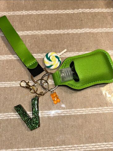 Aldi4u Empty Travel Bottles with Keychain Holder Set Include Portable Refillable with keychain alphabet later V epoxy resins green color with two charms 10" inches tall (Green, Epoxy resin) in Saudi Arabia