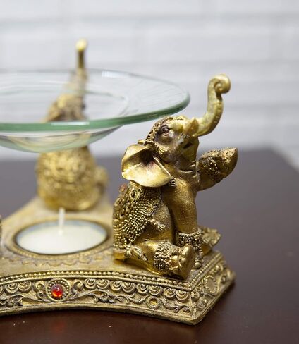 Ebros Feng Shui Trio Golden Tooled Thai البوذية الفيلة البوق ضوء الشاي شمعة النفط دفئا تمثال الشمع تورتة الموقد رائحة الناشر الراتنج بوذا الفيل تحت عنوان تمثال الزخرفية in Kuwait