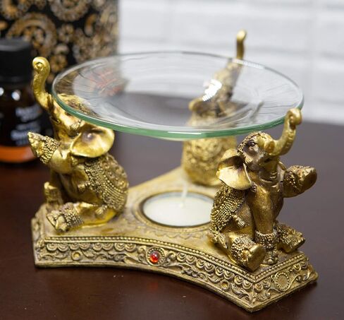 Ebros Feng Shui Trio Golden Tooled Thai البوذية الفيلة البوق ضوء الشاي شمعة النفط دفئا تمثال الشمع تورتة الموقد رائحة الناشر الراتنج بوذا الفيل تحت عنوان تمثال الزخرفية in Kuwait