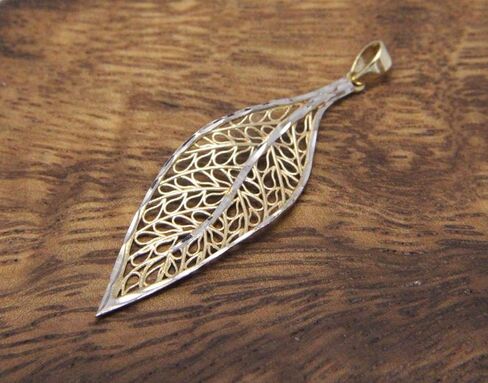Arthur's Jewelry 14k yellow gold white gold Hawaiian maile leaf filigree diamond cut pendant in Saudi Arabia