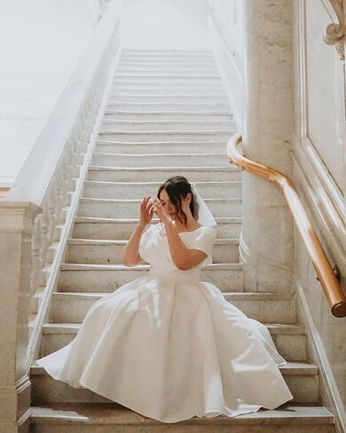 Women's Off Shoulder Wedding Dress for Bride Tea Length A Line Satin Formal Prom Dresses with Pockets in Saudi Arabia