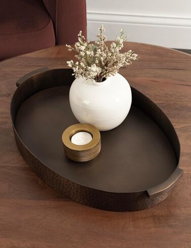 Kate and Laurel Samana Modern Oval Metal Tray, 16 x 10, Brass, Polished Decorative Serving Tray with Hammered Surface for Use as Ottoman Tray or Entryway Decor in Saudi Arabia