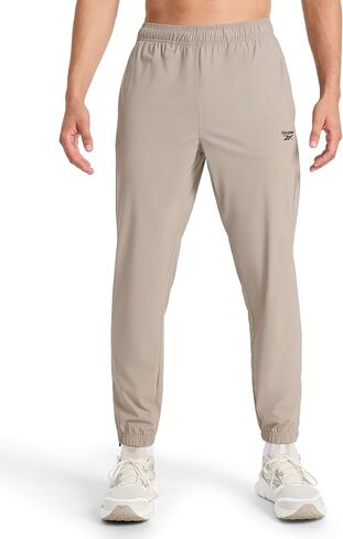 بنطال Reebok الرجالي، مقاس قياسي، درزة داخلية 76.2 سم، نسيج نايلون معاد تدويره قابل للتمدد خفيف الوزن in Saudi Arabia