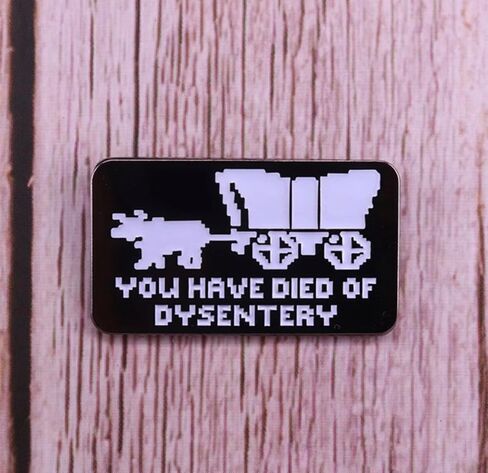 You Have Died of Dysentery Oregon Trail Hitched Wagon Classic Vintage 80s Video Game 1.4" Enamel Pin Badge in Saudi Arabia