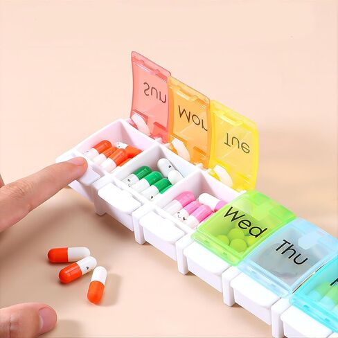 Weekly Pill Organizer Medicine Travel 7 Day Pill Organizer, Pills Box 7 Day Case with Spring Open and Large Compartment to Hold Vitamins, Cod Liver Oil, Supplements and Medication 8.66 * 1.97 in in Saudi Arabia