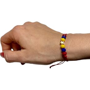 Red Venezuela bracelet in Saudi Arabia