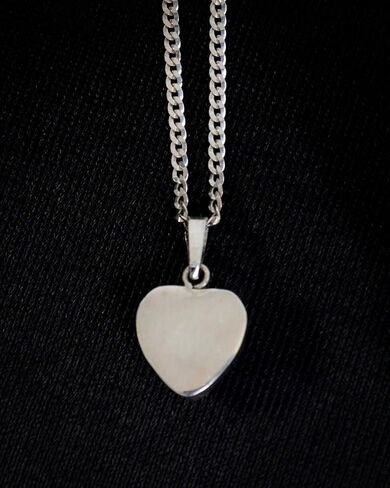 Handmade necklace with a beautiful 925 silver pendant and a natural blue stone in the shape of a heart, crafted artisanally. in Saudi Arabia