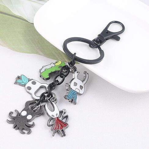 SONGCHANGJEWELRY Fantasy Epic Insect Adventure Keychain – Alloy & Enamel Pendant Bag Charm with Hero & Shadow Creature Motifs in Saudi Arabia