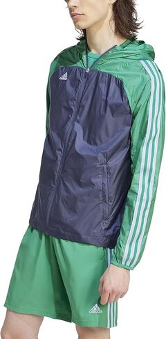 سترة Tiro Windbreaker Shadow للرجال من adidas، كحلي/أخضر كورت، متوسط/طويل in Saudi Arabia