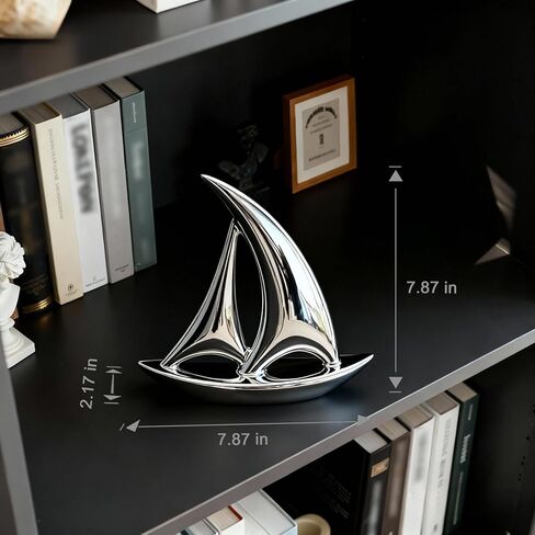 Jubiluxor ديكور المراكب الشراعية الفضية، منحوتة سيراميك 7.87"، تمثال قارب ساحلي بحري بلمسة نهائية مرآة، رف حديث وديكور رف الكتب لغرفة المعيشة أو المكتب، قطعة واحدة، هدية الانتقال لمنزل جديد in Saudi Arabia