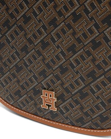 Tommy Hilfiger womens Monogram Leather Saddle Crossbody Bag With Adjustable Crossbody Strap in Saudi Arabia