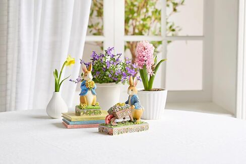 Enesco Beatrix Potter by Jim Shore Peter Rabbit Holding Daffodil Flowers Figurine, 6.22 Inch, Multicolor in Saudi Arabia