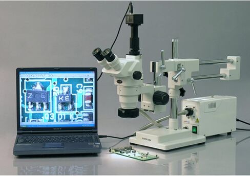 AmScope ZM-4T Professional Trinocular Stereo Zoom Microscope, EW10x Eyepieces, 6.7X-45X Magnification, 0.67X-4.5X Zoom Objective, Ambient Lighting, Double-Arm Boom Stand in Saudi Arabia