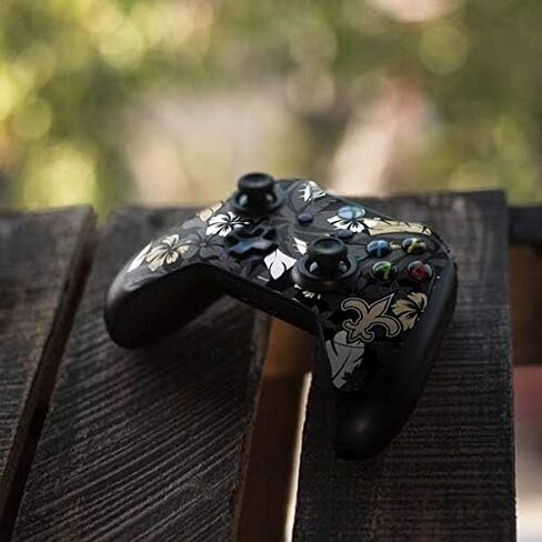 ملصق Skinit المخصص للألعاب متوافق مع وحدة تحكم Xbox One Elite - تصميم طباعة استوائية مرخص رسميًا من الدوري الوطني لكرة القدم الأمريكية (NFL New Orleans Saints) in Kuwait