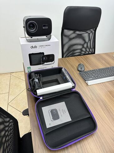 DUB Projector with TV Apps Included – Android 14 | 4K + 3D Support | Built-in Speaker | Wi-Fi & Bluetooth | Auto Focus | 2GB RAM | HDMI & 2× USB | Includes Smart Remote + Protective Case + Dust Cover. in Saudi Arabia