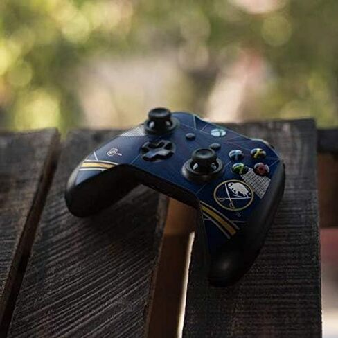 ملصق Skinit المخصص للألعاب متوافق مع وحدة تحكم Xbox One S - تصميم جيرسي منزلي مرخص رسميًا من NHL Buffalo Sabers in Kuwait