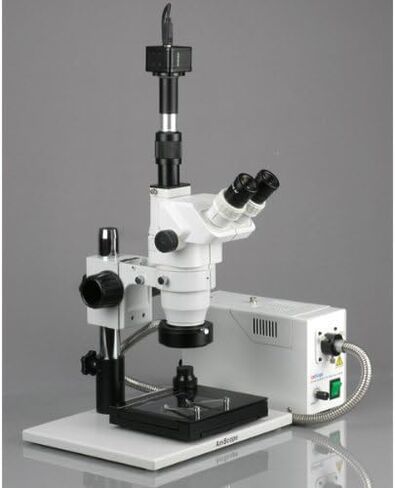 AmScope ZM-1TZ2-FOR-GT-10M مجهر تكبير ستيريو ثلاثي العينيات رقمي احترافي، عدسات EW10x وEW20x، تكبير 3.35X-180X، هدف تكبير 0.67X-4.5X، ضوء حلقة من الألياف الضوئية، حامل طاولة كبير على شكل عمود مع طاولة منزلقة، 110 فولت - 120 فولت، متضمنة in Saudi Arabia