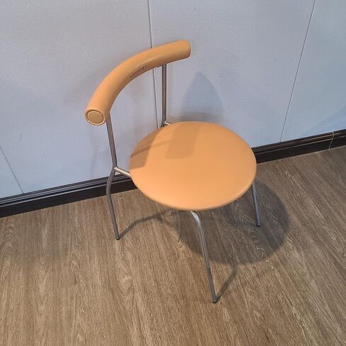 NOTONESET Dining chairs – Stylish and minimalist design, with a curved faux leather backrest and metal legs, exuding a modern feel. in Saudi Arabia