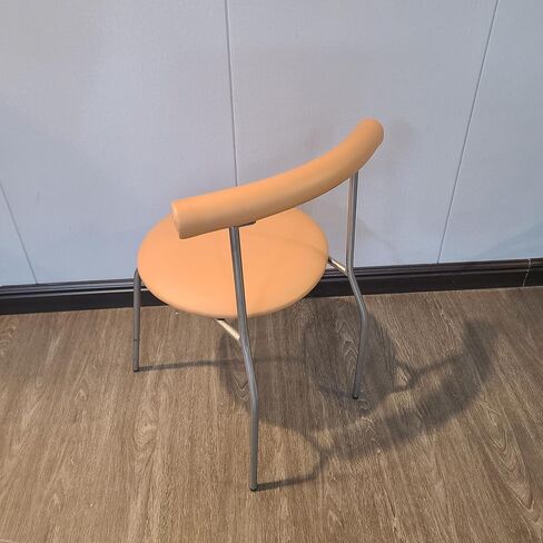 NOTONESET Dining chairs – Stylish and minimalist design, with a curved faux leather backrest and metal legs, exuding a modern feel. in Saudi Arabia