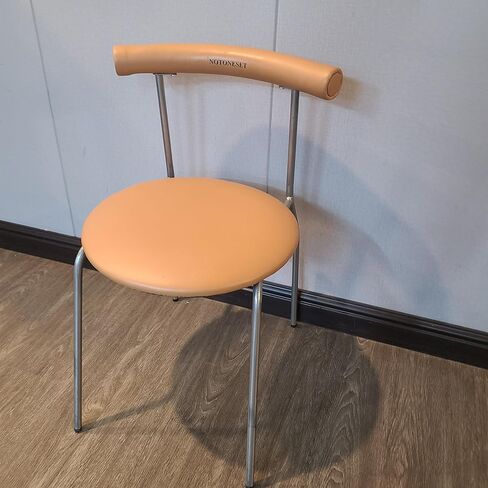 NOTONESET Dining chairs – Stylish and minimalist design, with a curved faux leather backrest and metal legs, exuding a modern feel. in Saudi Arabia