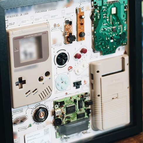 Framed Game Boy Teardown Display, Disassembled Retro Handheld Console Wall Art for Collectors and Game Room Decor in Saudi Arabia
