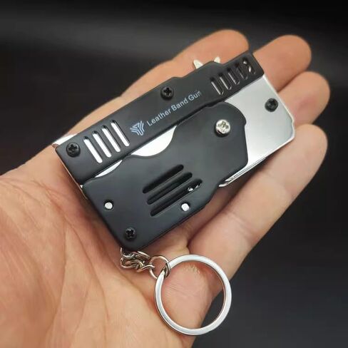 Mini Rubber Band Gun Metal Folding Gun Keychain with 100 Rubber Bands Made Entirely of zinc-Iron Alloy Material Sturdy and Durable (Black Leather Holster) in Kuwait