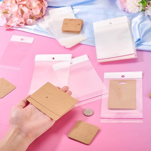 100Pcs Paper Jewelry Display Cards 2 Sizes with Plastic Cellophane Bags DIY Jewelry Display Packaging Dustproof Earrings Keychians Necklace Bracelet Charms Pendants Beads Handmade Crafts Gifts in Saudi Arabia