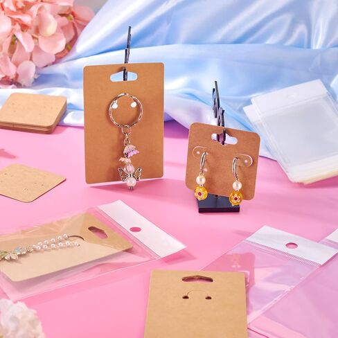 100Pcs Paper Jewelry Display Cards 2 Sizes with Plastic Cellophane Bags DIY Jewelry Display Packaging Dustproof Earrings Keychians Necklace Bracelet Charms Pendants Beads Handmade Crafts Gifts in Saudi Arabia