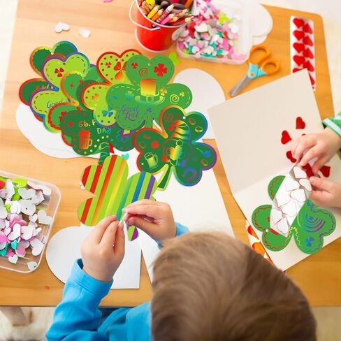 JarThenaAMCS 60Set St. Patrick's Day Shamrock Scratch Art Set Green Clover Scratch Paper with Ribbon Wooden Stylus Stick 3 Colors Scratch Off Paper for DIY Craft Classroom School Irish Party Supplies in Saudi Arabia