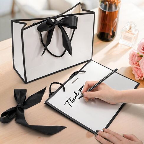Tebery 30 Pack Gift Bags with Handle, Medium Thank you Paper Bag Bulk with Bow Ribbon, White and Black Wrap Bags for Valentine's Day Party Wedding Bridesmaid Birthday Graduation Housewarming, 11 x 3.9 x 7.8 Inch in Saudi Arabia