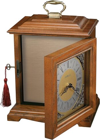 Howard Miller Continuum Mantel Clock Urn Box 800-120 - لمسة نهائية من خشب البلوط يوركشاير، اختر الأخشاب الصلبة والقشرة، ساعة أرقام رومانية على شكل قوس، مقصورة داخلية، صندوق جرة الجنازة in Saudi Arabia