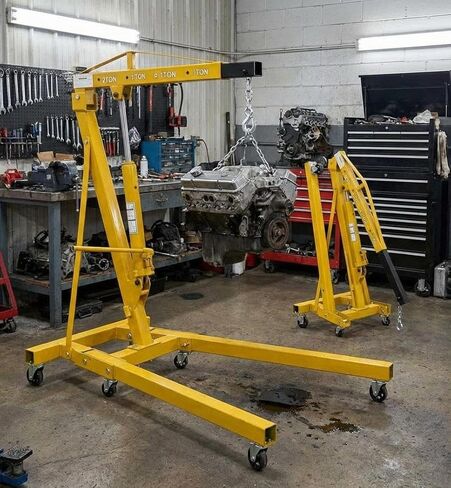  2 Ton Folding Engine Hoist Hydraulic Shop Crane, 4400 Lb Capacity Cherry Picker with Telescoping Boom & 6 Caster Wheels - Includes Storage Stand for Garage Auto Repair, Yellow in Saudi Arabia