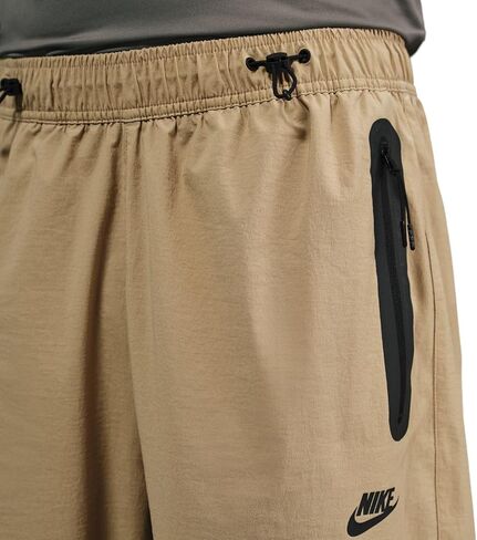 بنطال منسوج كبير الحجم للرجال من Nike Tech (HM7158-297، بيج باراشوت/بيج باراشوت/أسود) مقاس XX-Large in Saudi Arabia