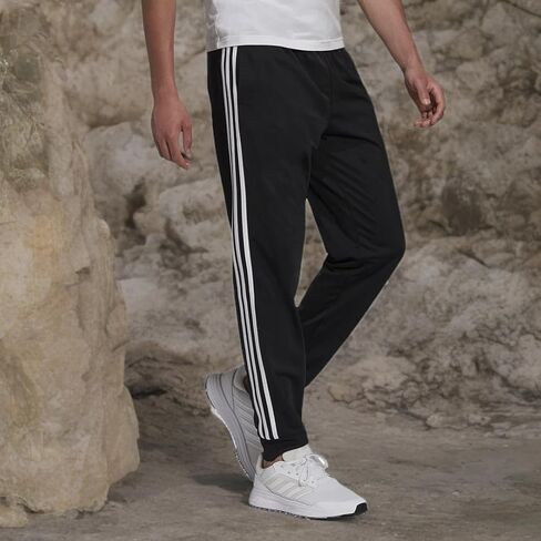 بنطال Adidas رجالي دافئ من التريكو مدبب 3 خطوط أسود/أبيض 4X-Large/Tall in Kuwait