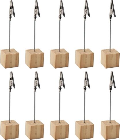 10 قطع خشبية فاتحة اللون، قاعدة مكعبة خشبية، حوامل مشبك للمذكرات، حامل مشبك التمساح لأرقام الطاولة، وبطاقات المكان، والصور، وديكورات الزفاف in Kuwait