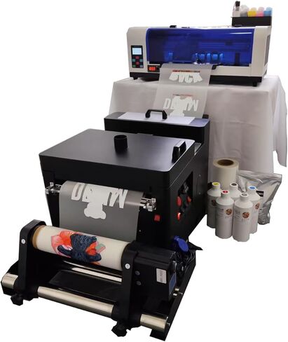 طابعة XP600 DTF مزودة بآلة مجفف اهتزاز، مستقرة وملونة، وتتضمن حبرًا وفيلمًا ومسحوقًا بحجم 5 × 500 مل in Kuwait