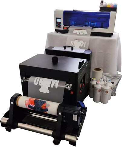 طابعة XP600 DTF مزودة بآلة مجفف اهتزاز، مستقرة وملونة، وتتضمن حبرًا وفيلمًا ومسحوقًا بحجم 5 × 500 مل in Kuwait