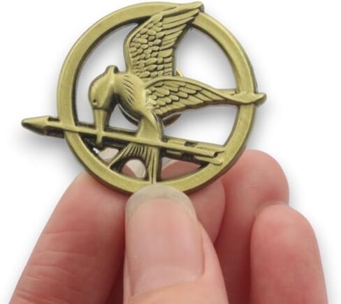 The Hunger Games, Mockingjay Pin Badge 33mm x 38mm, 2mm thick. Perfect for Backpacks, Jackets, and Hats, Iconic Movie Merchandise - A Symbol of Rebellion and Hope in Kuwait
