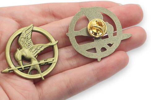 The Hunger Games, Mockingjay Pin Badge 33mm x 38mm, 2mm thick. Perfect for Backpacks, Jackets, and Hats, Iconic Movie Merchandise - A Symbol of Rebellion and Hope in Kuwait
