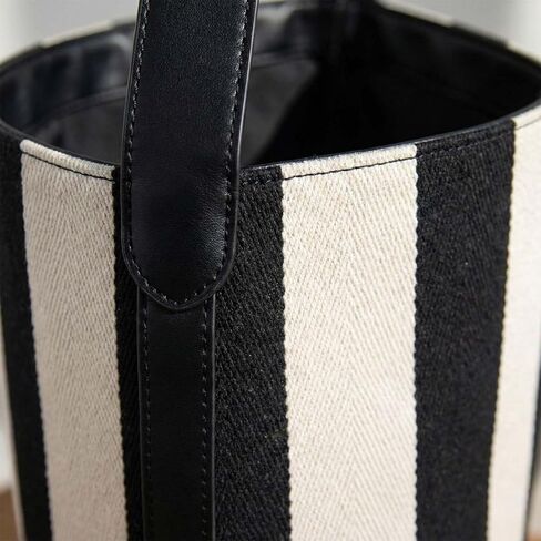 Women's Canvas Bucket Bag Black and White Striped Shoulder Purse Minimalist Hobo Tote Handbag with Vegan Leather Strap for Work Travel and Daily Use in Saudi Arabia