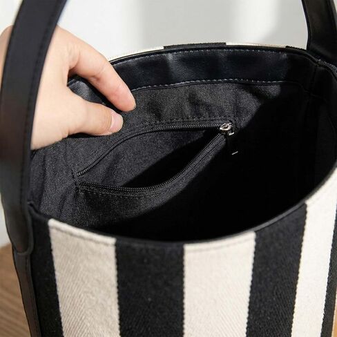 Women's Canvas Bucket Bag Black and White Striped Shoulder Purse Minimalist Hobo Tote Handbag with Vegan Leather Strap for Work Travel and Daily Use in Saudi Arabia