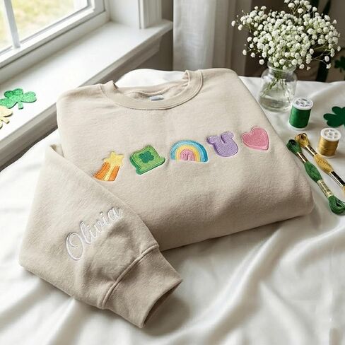 Embroidered Lucky Symbols Sweatshirt Women Personalized Name Sleeve Detail St Patricks Day Clover Rainbow Pullover Beige Crewneck Magical Marshmallow Theme Custom Long Sleeve Top in Saudi Arabia