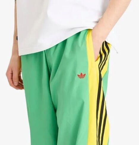 بنطال رياضي فضفاض للرجال من adidas Originals، أخضر طاقة، مقاس متوسط in Saudi Arabia