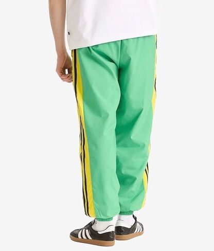 بنطال رياضي فضفاض للرجال من adidas Originals، أخضر طاقة، مقاس متوسط in Saudi Arabia
