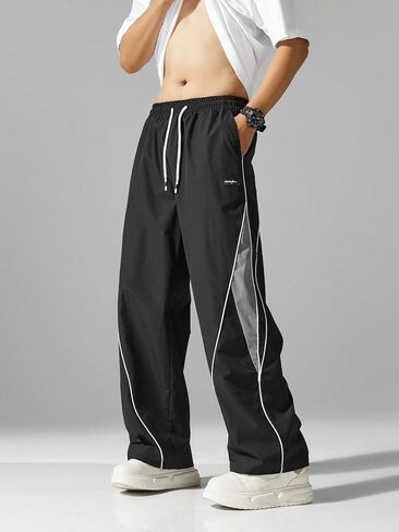 Mens Relax Fit Parachute Pants Letter Embroidery Color Block Panel Drawstring Waist Casual Sports Jogger Sweatpants in Saudi Arabia