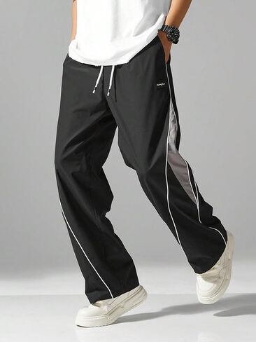 Mens Relax Fit Parachute Pants Letter Embroidery Color Block Panel Drawstring Waist Casual Sports Jogger Sweatpants in Saudi Arabia