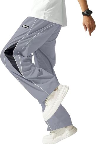 سروال باراشوت رجالي مريح ومطرز بحروف وكتلة ألوان ورباط وخصر رياضي غير رسمي in Kuwait