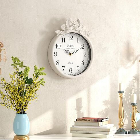 ساعة حائط فرنسية صغيرة مع فيونكة، طراز بوهو أبيض عاجي عتيق، ساعات حائط مزخرفة تعمل بالبطارية الصامتة للمزرعة وغرفة النوم والحمام وهدايا المنزل الجديد (10 بوصة ارتفاع × 7.9 بوصة عرض) in Kuwait
