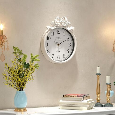 ساعة حائط فرنسية صغيرة مع فيونكة، طراز بوهو أبيض عاجي عتيق، ساعات حائط مزخرفة تعمل بالبطارية الصامتة للمزرعة وغرفة النوم والحمام وهدايا المنزل الجديد (10 بوصة ارتفاع × 7.9 بوصة عرض) in Kuwait