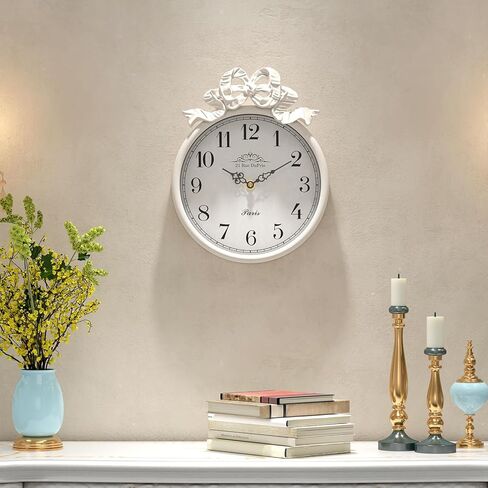 ساعة حائط فرنسية صغيرة مع فيونكة، طراز بوهو أبيض عاجي عتيق، ساعات حائط مزخرفة تعمل بالبطارية الصامتة للمزرعة وغرفة النوم والحمام وهدايا المنزل الجديد (10 بوصة ارتفاع × 7.9 بوصة عرض) in Kuwait